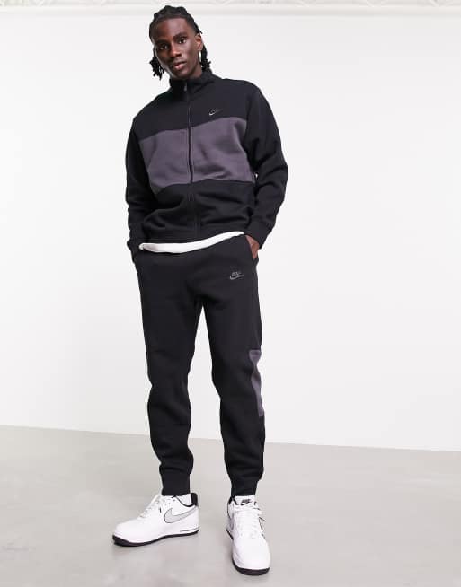 Nike Trainingspak van fleece met ritssluiting en kleurvlakken in zwart ASOS