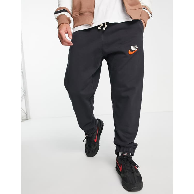 Nike Trend Fleece zip cuffed retro logo sweatpants in black