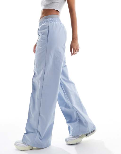 https://images.asos-media.com/products/nike-trend-woven-baggy-parachute-pants-in-light-blue/205274769-3?$n_640w$&wid=513&fit=constrain