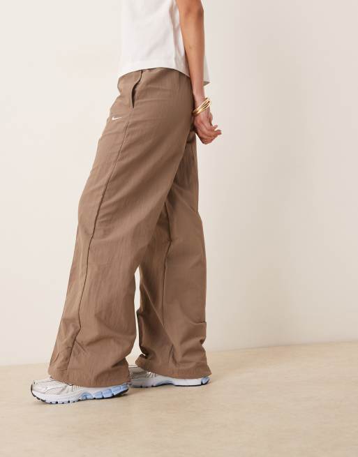 Nike Trend woven mid-rise track pants in brown ASOS