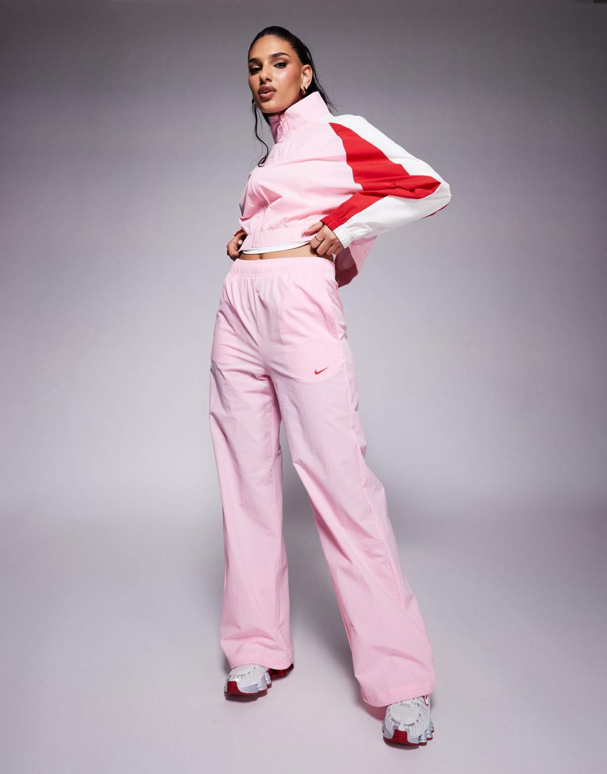 Nike Trend woven windrunner jacket and wide leg trouser in pink and red