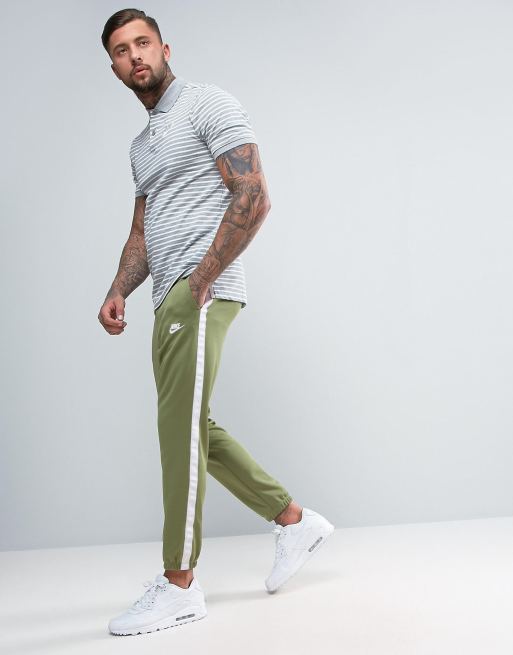 Nike tribute on sale track pants green