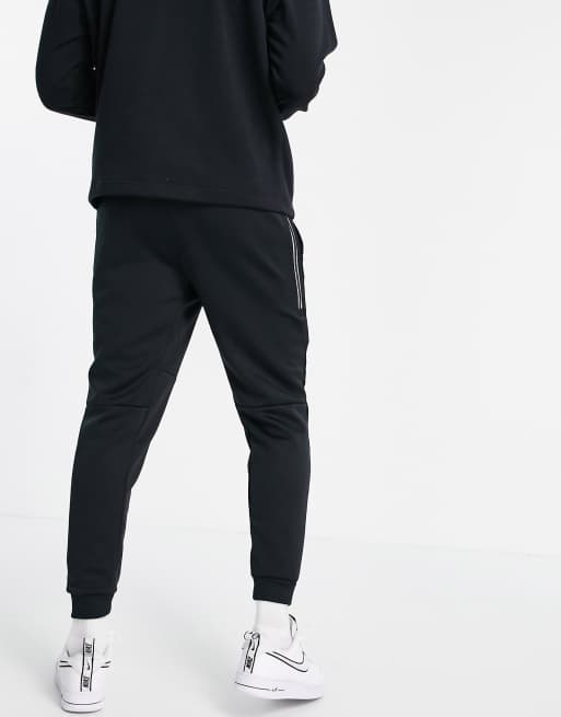 Nike Tribute knit joggers in black ASOS