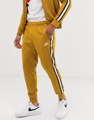 white and gold nike tracksuit