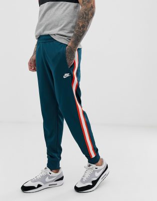 Nike tribute store track pants green