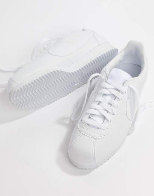 Nike triple white on sale leather cortez trainers