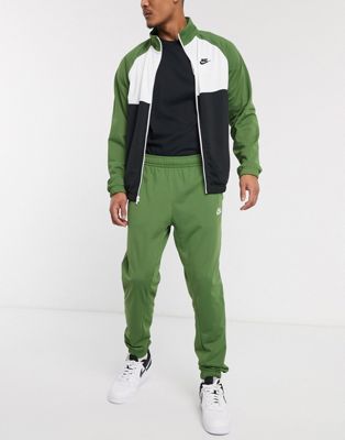 Nike - Tuta sportiva in maglia di poliestere verde con zip | ASOS