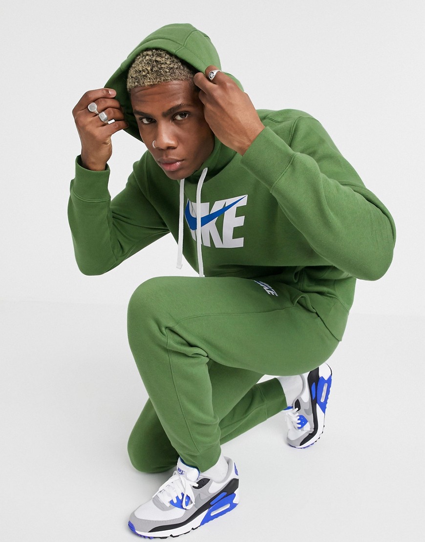 Nike - Tuta sportiva verde con cappuccio