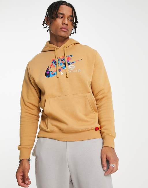 Nike unisex hoodie with chest logo in elemental gold | ASOS