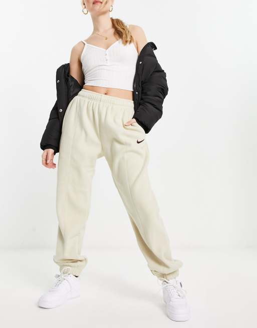 Nike Unisex plush mini swoosh fleece joggers in rattan beige