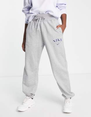 Nike Unisex retro athletics fleece joggers in grey heather and navy