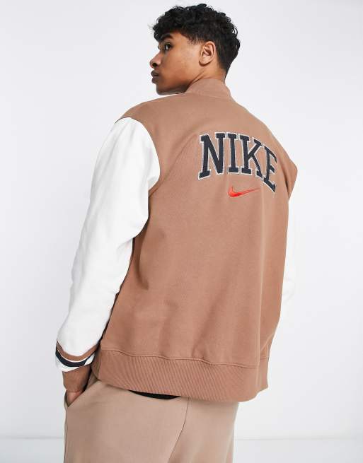 Nike unisex retro collegiate varsity jacket in archaeo brown | ASOS