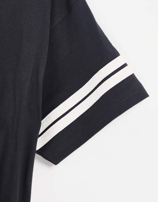 Nike – Unisex-T-Shirt in verwaschenem Schwarz mit Oversize-Schnitt, College-Design und Retro-Logo, 4 von 4