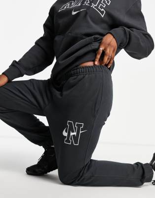 Nike unisex vintage logo fleece oversized sweatshirt in washed black Clearance