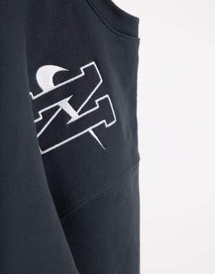 Nike unisex vintage logo fleece oversized sweatshirt in washed black Clearance
