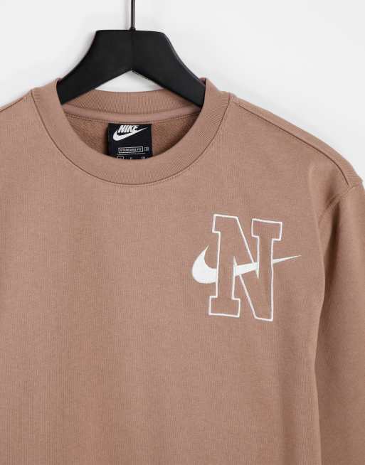 Nike Unisex logo fleece sweatshirt in washed brown | ASOS