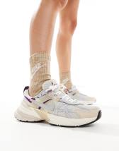 New Balance 1906 sneakers in white with blue and pink details