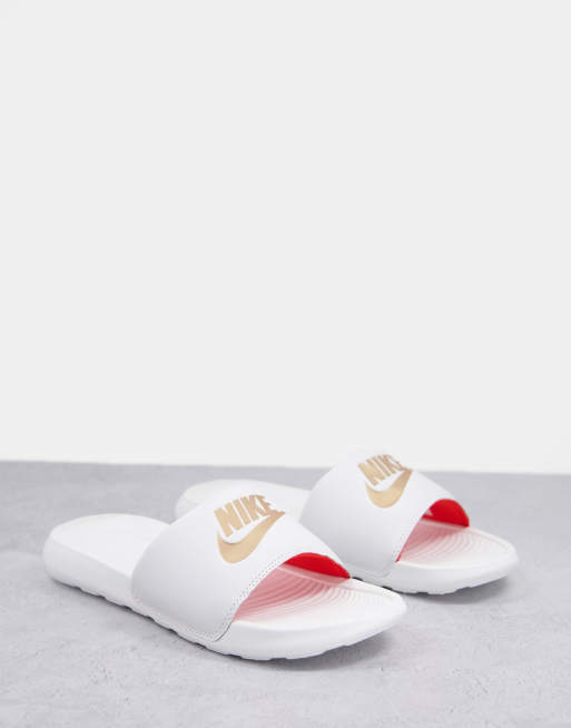 Nike slides gold outlet logo