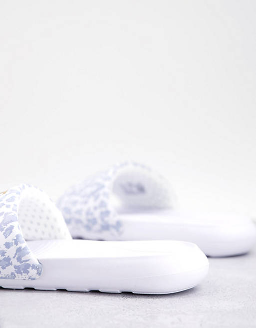 Women Flip Flops/Nike Victori sliders in white leopard print and gold swoosh 