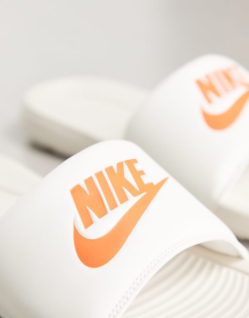 Nike Victori Slides in white and orange