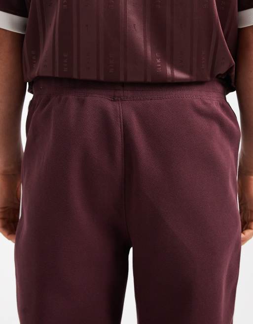 Nike – Vinröda, avsmalnande mjukisbyxor med ränder, 4 av 5