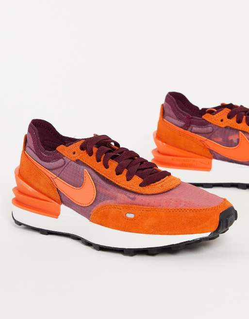 Maroon and store orange nike shoes