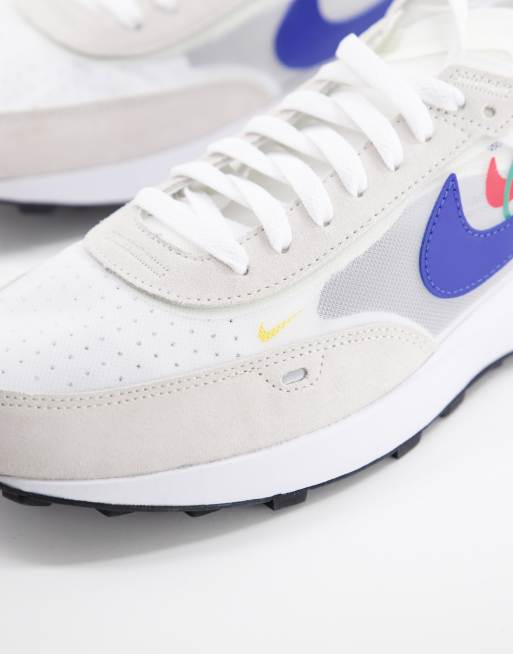 White nike trainers store blue tick