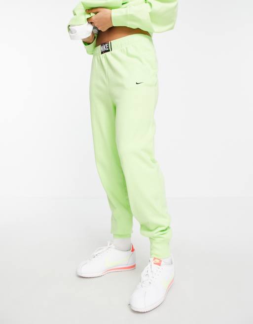 Nike washed high rise joggers in neon green ASOS