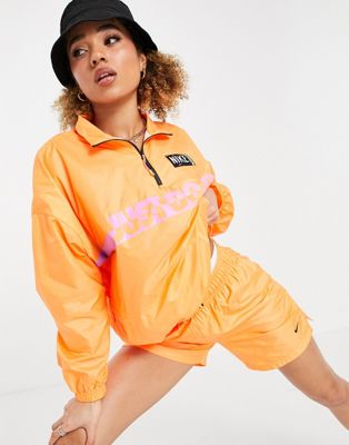 Nike washed woven jacket in orange and pink ombre