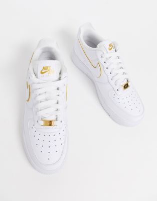 gold and white nike air force 1
