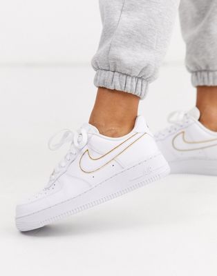 white air forces with gold outline