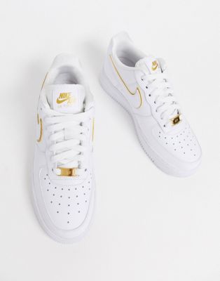 nike white & gold air force 1 07 trainers