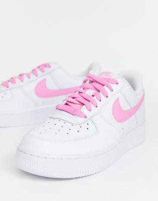 white nike shoes with pink swoosh