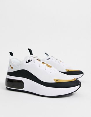 nike black white and gold shoes