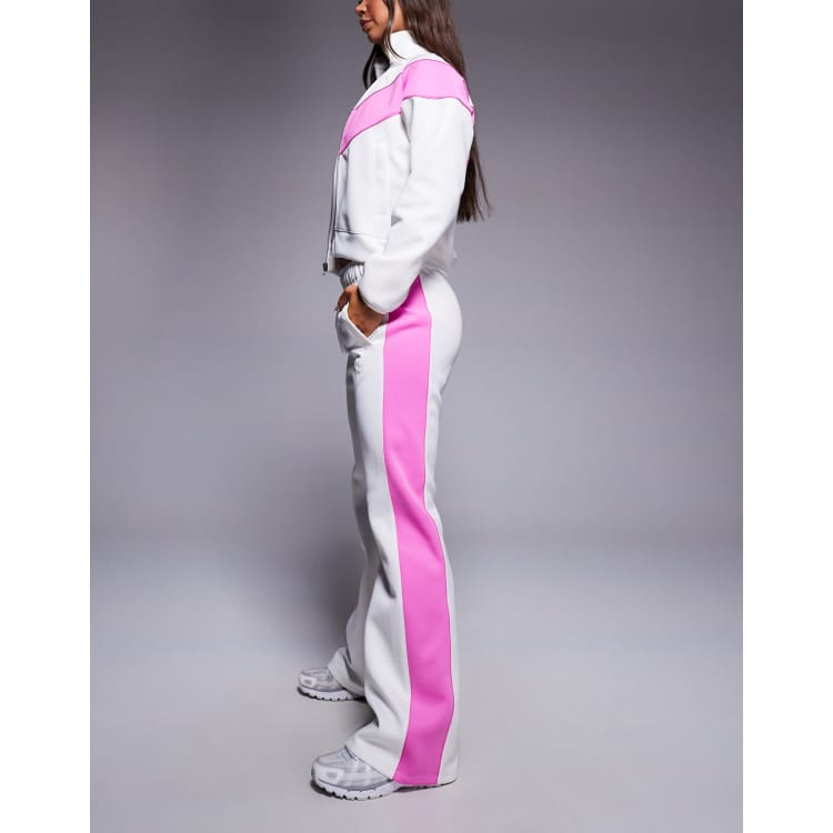 Nike Windrunner track pants in off white and pink | ASOS