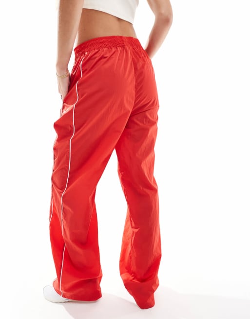 Nike windrunner track pants in red