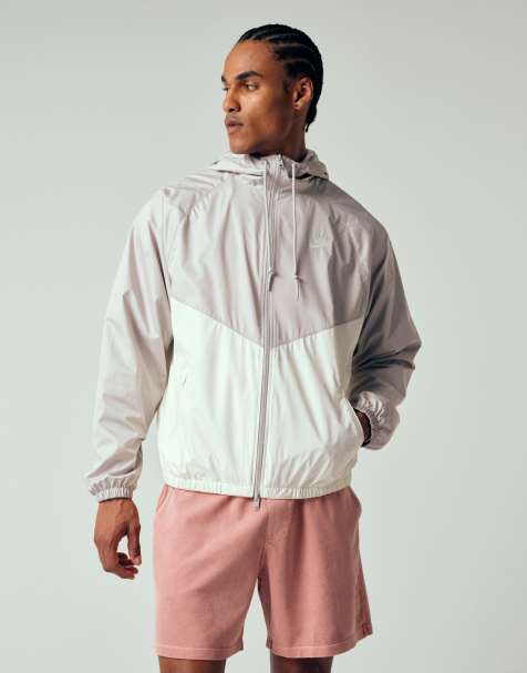 Nike – Windrunner – Trainingsjacke in Hellgrau und Weiß - view 1
