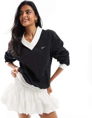 Nike Nike Windrunner woven long sleeve crew neck top in black