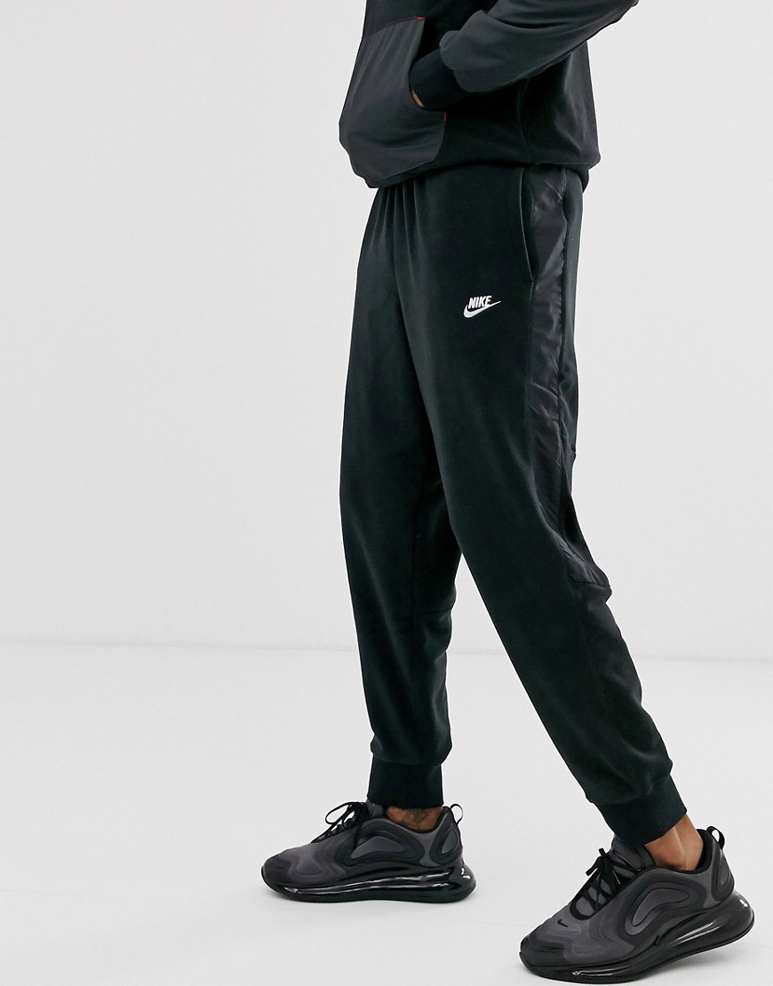 Nike winter fleece cuffed joggers with nylon panels in black