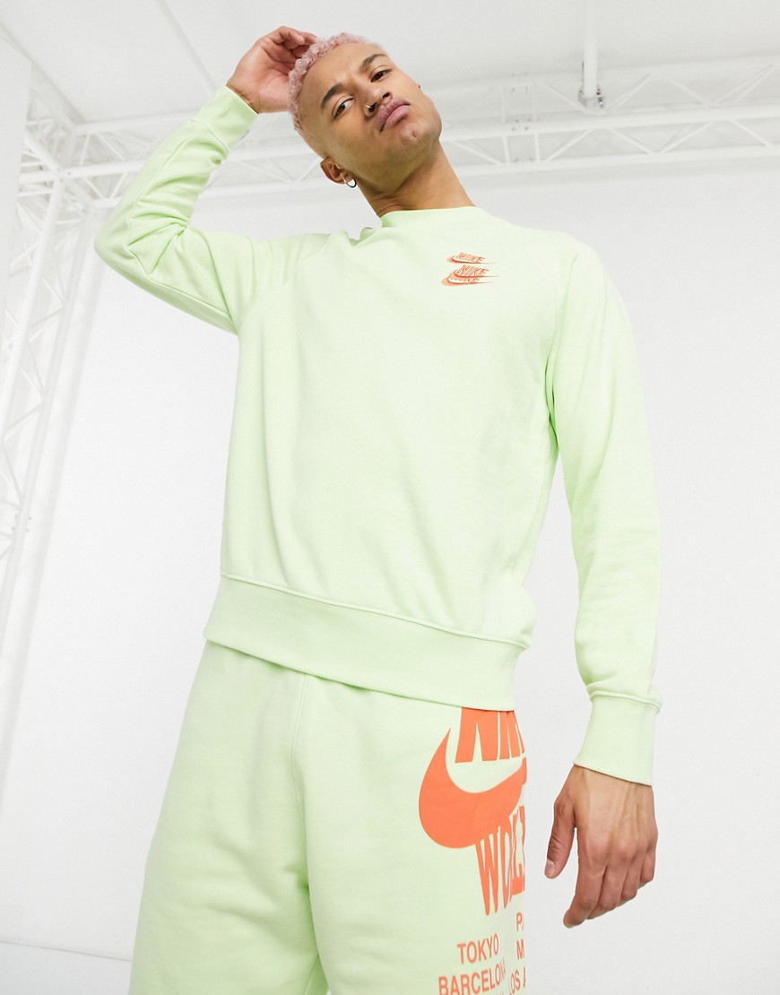 Nike World Tour Pack graphic crew neck sweatshirt in lime-Green