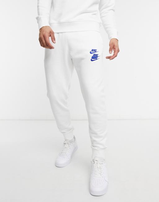 Nike World Tour Pack graphic cuffed joggers in white ASOS