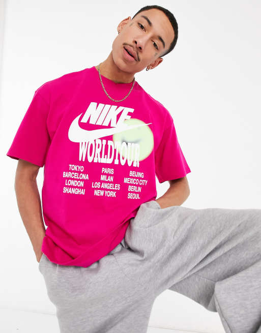 Nike World Tour Pack graphic oversized T-shirt in pink