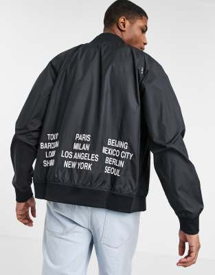 Nike World Tour Pack graphic woven bomber jacket in black