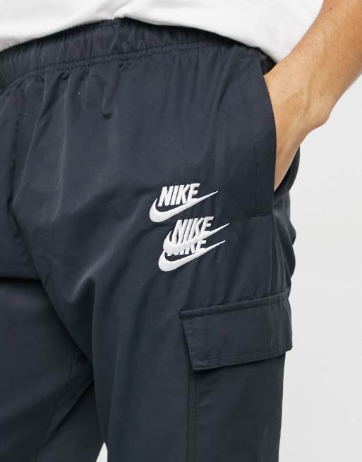 Nike World Tour Pack graphic woven cuffed cargo joggers in black