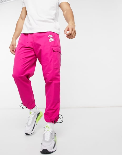 https://images.asos-media.com/products/nike-world-tour-pack-graphic-woven-cuffed-cargo-joggers-in-pink/21383614-2?$n_640w$&wid=513&fit=constrain