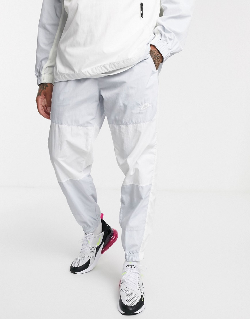 Nike woven cuffed joggers in white