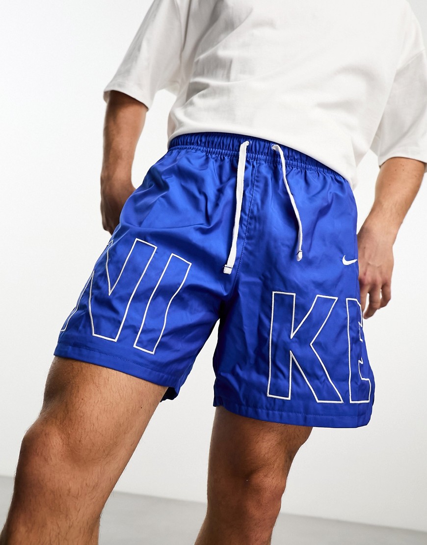 NIKE WOVEN LOGO PRINTED SHORTS IN BLUE