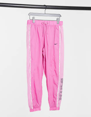 Nike woven pant with piping in pink | ASOS