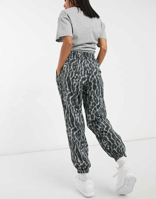 Nike woven pants with animal print in gray