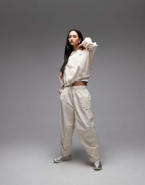 Nike woven straight leg trousers in cream - view 1